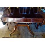 A Regency-style rosewood sofa table on scrolled undertier and outswept supports,