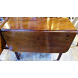 A 19th century mahogany drop-flap dining table.