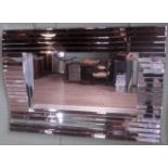 A contemporary stylized wall mirror.