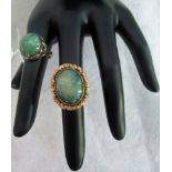 A 9ct gold mounted green quartz dress ring together with another similar.