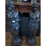 A large pair of contemporary figures, modelled as The Water Carriers.