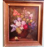 A large gilt framed oil on canvas, still life, floral studies.
