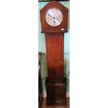 An early 20th century oak granddaughter clock.