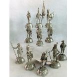 A collection of eleven hand crafted pewter figurines depicting various military soldiers.