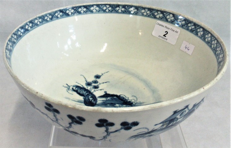 A 19th century Worcester blue and white bowl decorated in the Oriental manner depicting tree,