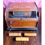 A 19th century Cabinet Roller Organ manufactured by the Auto Phone Co.