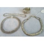 A multi strand snake link silver choker,