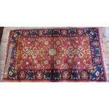 A small patterned rug, 140 x 76cm.