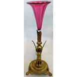 A Victorian cranberry glass vase on a gilt metal stand,