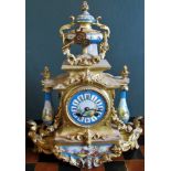 A 19th century ormolu mantle clock, with enamel dial, supports and plaque to base,