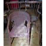 A pair of stick back carver chairs, together with a Lloyd Loom chair.