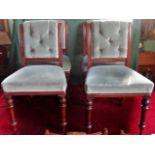 A set of four Edwardian mahogany framed ironing chairs with upholstered stuffed over seats and