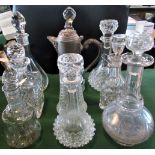 Nine miscellaneous cut and moulded glass decanters.