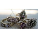 A lady's diamond and gem set cluster ring, the crown with multiple claw mounts,