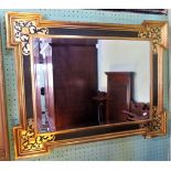 A contemporary gilt framed wall mirror.