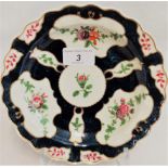 An 18th century blue seal plate with swags, Scottish flowers and mirror shape cartouche,
