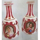 A pair of 19th century Bohemian glass decanters with enamel decoration each having three oval