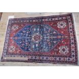 A small patterned Shiraz rug, 148 x 102cm. Condition Report: Overall condition good.