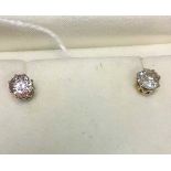 A pair of single stone diamond earrings,
