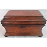 A 19th century rosewood esophagus tea caddy on bun feet (lacking mixing bow).