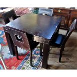 A contemporary dining table and four chairs.