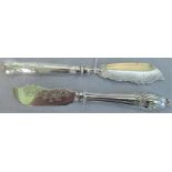 Two decorative silver butter knives with engraved and relief decoration,