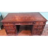 An early 20th century oak partners desk,