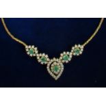 An emerald and diamond necklace,