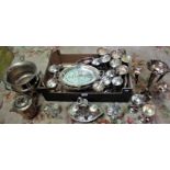A silver plated epergne, ice bucket, food warmer, goblets and other items.