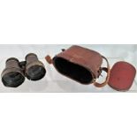 A pair of Voigtlander (Sen Glass) binoculars in a leather case.