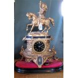 A 19th century ormolu mantle clock, having black enamel dial and Roman numerals,