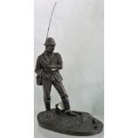 A reproduction figural group, modelled as a fly fisherman.