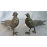 A pair of white metal table decorations in the form of pheasants,13cm high & 28cm long.