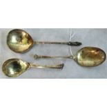 Three gilt metal ecclesiastical spoons of varying design, one having Madonna and child finial,