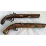 Two early 19th century dueling pistols.