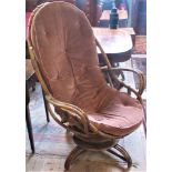 A 20th century faux bamboo swivel conservatory chair.