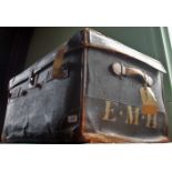 A large leather travelling trunk, bearing the initials E. M. H.