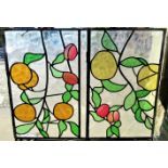 A pair of 19th century stained glass panels, one bearing the name L E Sutherland,