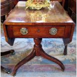 An Edwardian single drawer Pembroke table, on central column and tripod base.