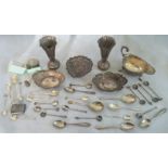 A quantity of silver items to include: spill vases, sauce boat, bon-bon dishes,