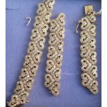 A gold and diamond bracelet of entwined link design (AF). Condition Report: 23.