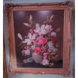 A large ornate gilt framed oil on board of floral studies, signed John E Nicholls '49.