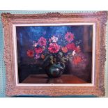 A large gilt framed oil on canvas, still life floral arrangement.