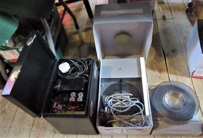 A Singer sewing machine in original carrying case, together with a Rollei slide projector.