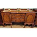 A 20th century walnut serpentine fronted sideboard,