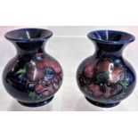 A small pair of Moorcroft vases, each 10cm high.