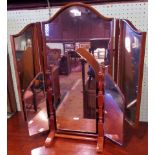 A reproduction mahogany three section swing toilet mirror, together with a smaller, similar.