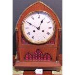 An early 20th century architectural oak mantle clock,