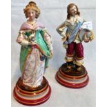 A pair of 19th century Continental figures of a cavalier and his female companion, each 30cm tall.