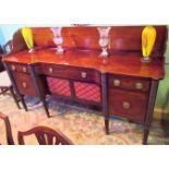 An early 19th century possibly Irish mahogany sideboard, with high back plate support,